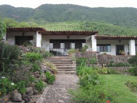 House in Jocotepec with mountains in the background – Best Places In The World To Retire – International Living