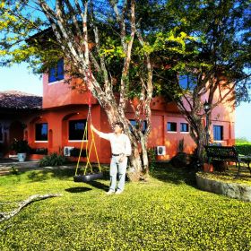 Man standing by home at Equus Village, Pedasi Panama – Best Places In The World To Retire – International Living