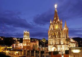 San Miguel de Allende with parroquia lit at night – Best Places In The World To Retire – International Living