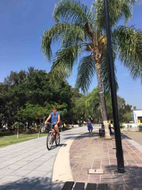 Riding a  bike along the malecon in Lake Chapala – Best Places In The World To Retire – International Living
