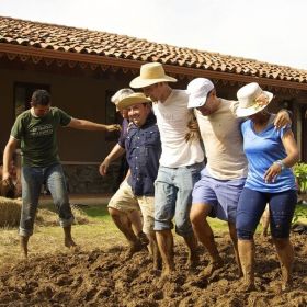 Cubita Development staff building a mud house for a neighbor, Chitre, Panama – Best Places In The World To Retire – International Living