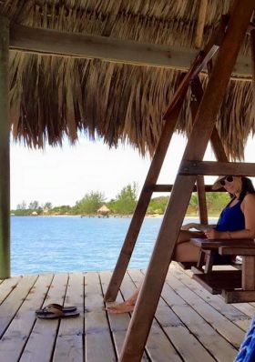 Enjoying the covered deck swing at Vision Properties, Placencia, Belize – Best Places In The World To Retire – International Living
