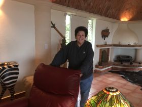 Susie Ozman with her comfortable living room, Rancho Los Labradores, San Miguel de Allende, Mexico – Best Places In The World To Retire – International Living