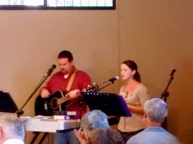 John Gilbert singing hyms with Megan Webster Gilbert at  Boquete Bible Fellowship Church, Boquete, Panama – Best Places In The World To Retire – International Living