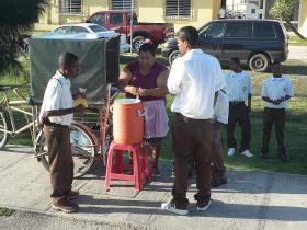 Kids buying juice before school in Belize City, Belize – Best Places In The World To Retire – International Living