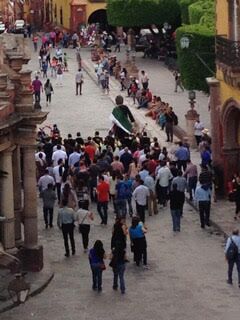 Looking down from a rooftop bar at the people in the street in the town of San Miguel Allende, Mexico – Best Places In The World To Retire – International Living