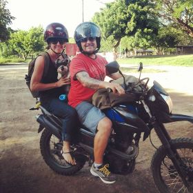 Elisha MacCay  and her husband on the road with their dog and motorcycle, San Juan de Sur, Nicaragua – Best Places In The World To Retire – International Living