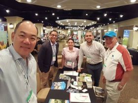 Representives from Tucan Golf Course and Resorts  promoting their property as a yearlong golf destination at an international convention – Best Places In The World To Retire – International Living
