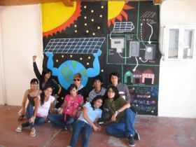 Students in front of a roof top solar panel mural in La Paz, Mexico – Best Places In The World To Retire – International Living