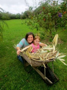 The Gilbert girls gather leaf matter from their property for their chicken coop, Volcan, Panama – Best Places In The World To Retire – International Living