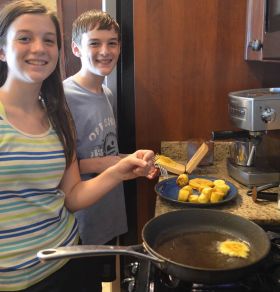 The Gilbert kids preparing fried plantains, Volcan, Panama – Best Places In The World To Retire – International Living