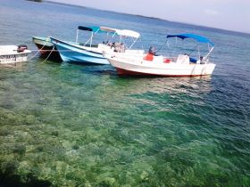 Bocas del Toro boats tied up in dock – Best Places In The World To Retire – International Living