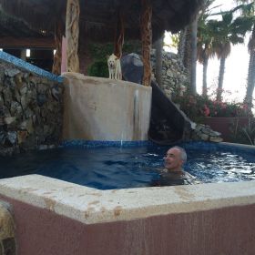 Chuck Bolotin with a dog at Baja de Sueno in Baja California Sur in pool
