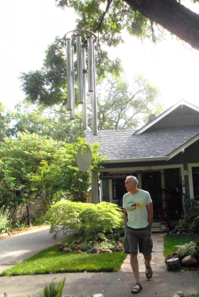 Chuck Bolotin getting close to giant wind chime