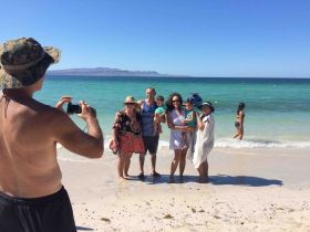 Chuck Bolotin taking a picture at Tecolote, Baja California Sur