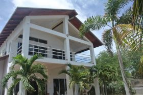 Nicaragua modern house from outside, looking up, with palm trees – Best Places In The World To Retire – International Living