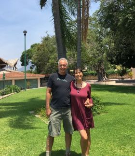 Jet Metier and Chuck Bolotin on the grass in Mexico