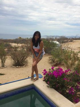Jet Metier posing on a pool with view of Sea of Cortez in Baja California Sur