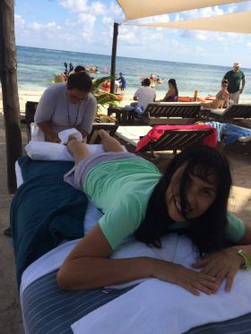 Jet Metier getting a massage on the beach at Mahahual, Mexico