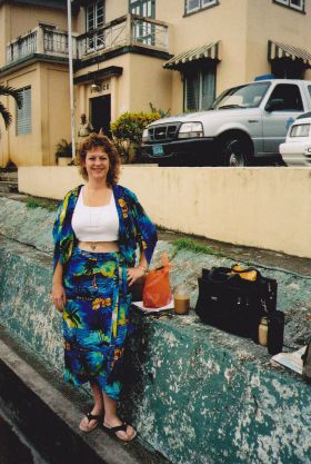 Macarena Rose waiting for a bus in San Ignacio, Belize – Best Places In The World To Retire – International Living