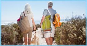 Two retired people walking towards the beach – Best Places In The World To Retire – International Living
