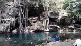 X'Batun cenote in Yucatan, Mexico, with about 10 people in it.