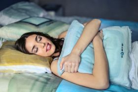 Happy woman in a bed