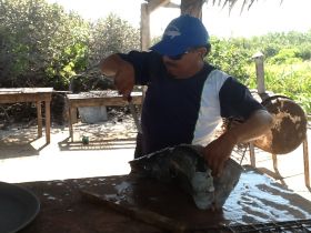 Man carving dinner at Isla Contoy – Best Places In The World To Retire – International Living