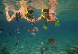 Two snorkelers with fish off Isla Mujeres – Best Places In The World To Retire – International Living