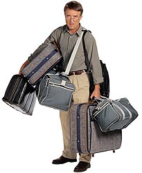 Man holding suitcases – Best Places In The World To Retire – International Living