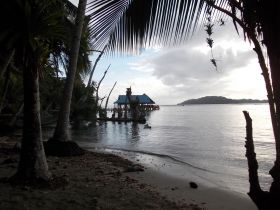 Bocas Del Toro sunset, water, and palm trees – Best Places In The World To Retire – International Living